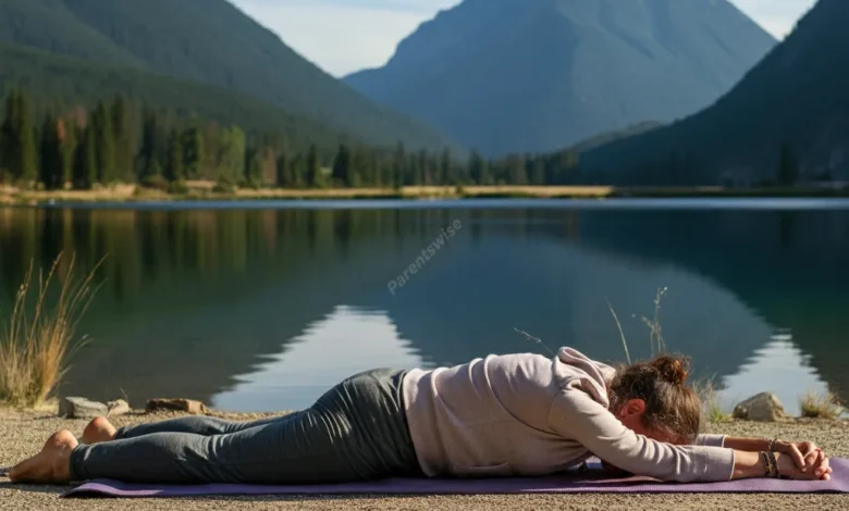 A tired but smiling parent taking a moment for themselves, perhaps doing yoga or meditating